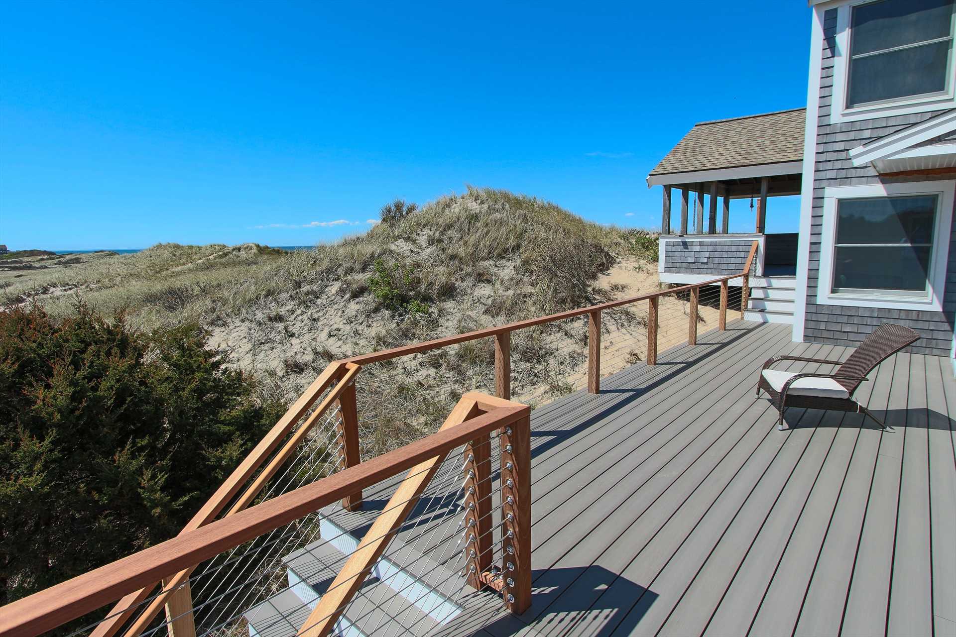 Nestled in the Dune, walk up and enter the house.
